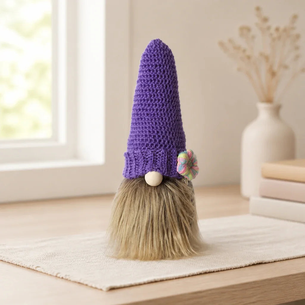 Handmade crochet gnome with purple hat and fluffy beard, cozy home decor accent