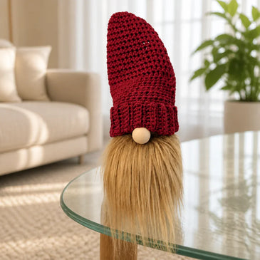 Handmade crochet gnome with red hat and fluffy beard, cozy home decor accent