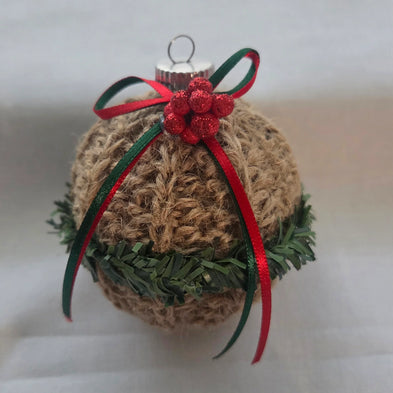 Rustic Christmas ornament with jute twine, red bow, green garland, and glitter berries