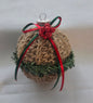 Rustic Christmas ornament with jute twine, red bow, green garland, and glitter berries