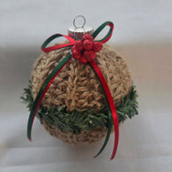 Rustic Christmas ornament with jute twine, red bow, green garland, and glitter berries