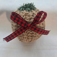 Rustic Christmas ornament with jute twine, red plaid ribbon bow, and faux greenery top