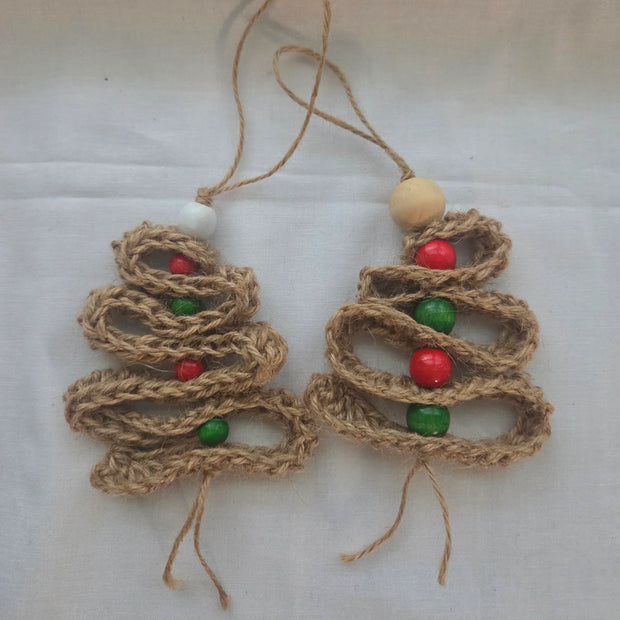 Handmade jute Christmas tree ornaments with red and green beads on white background