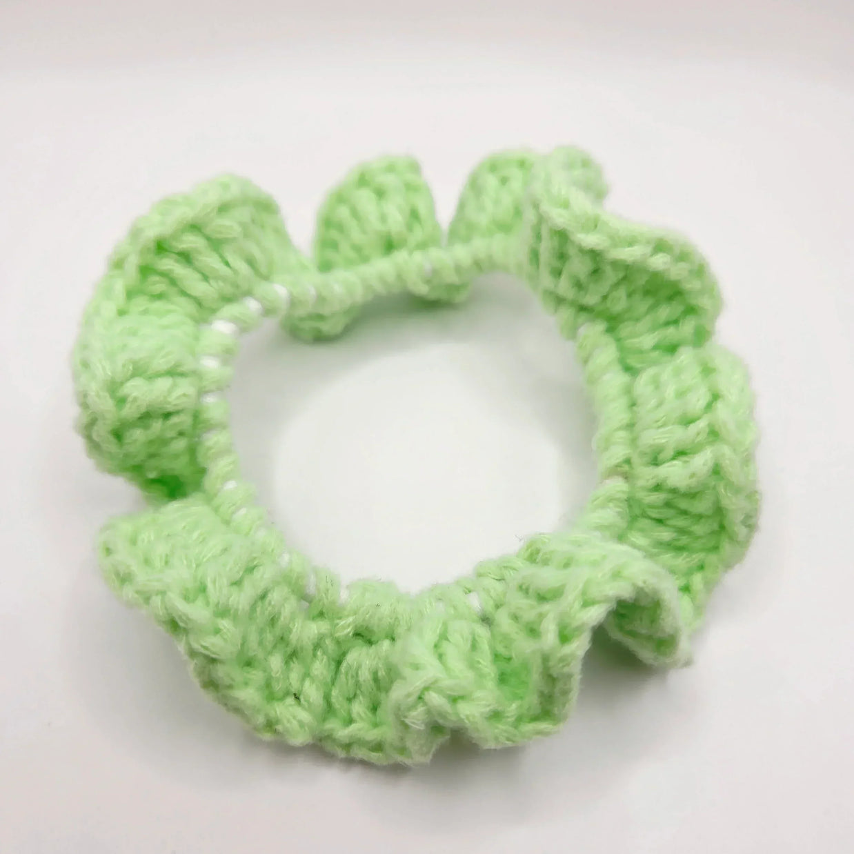 Handmade mint green crochet hair scrunchie, cozy and creative accessory for everyday use