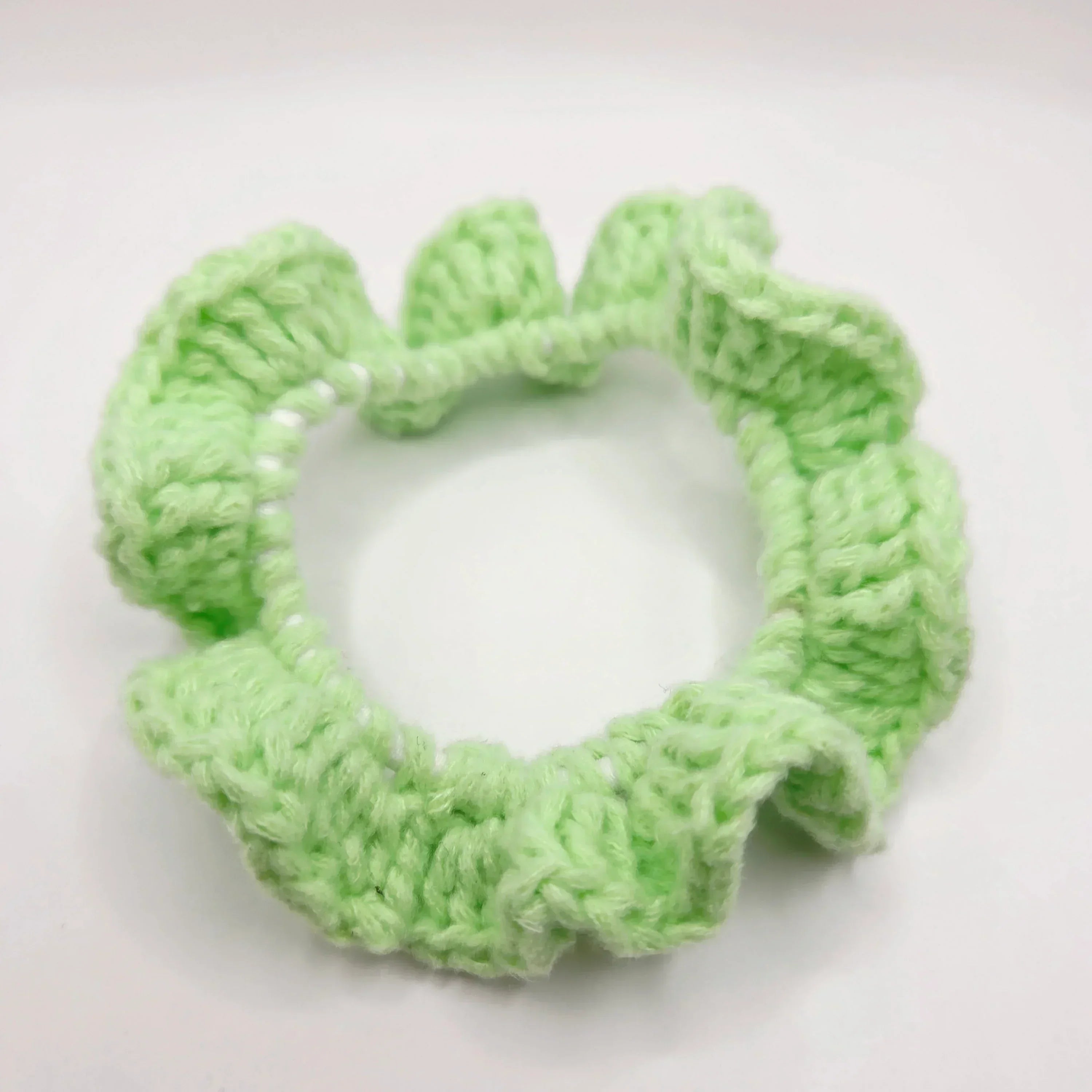 Handmade mint green crochet hair scrunchie, cozy and creative accessory for everyday use