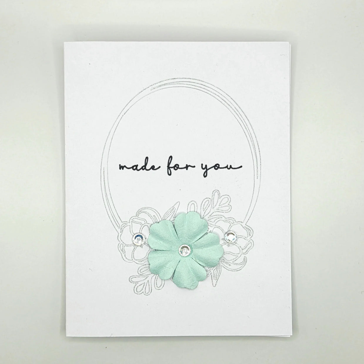 Handmade card with mint flower, 'made for you' text, and silver embellishments