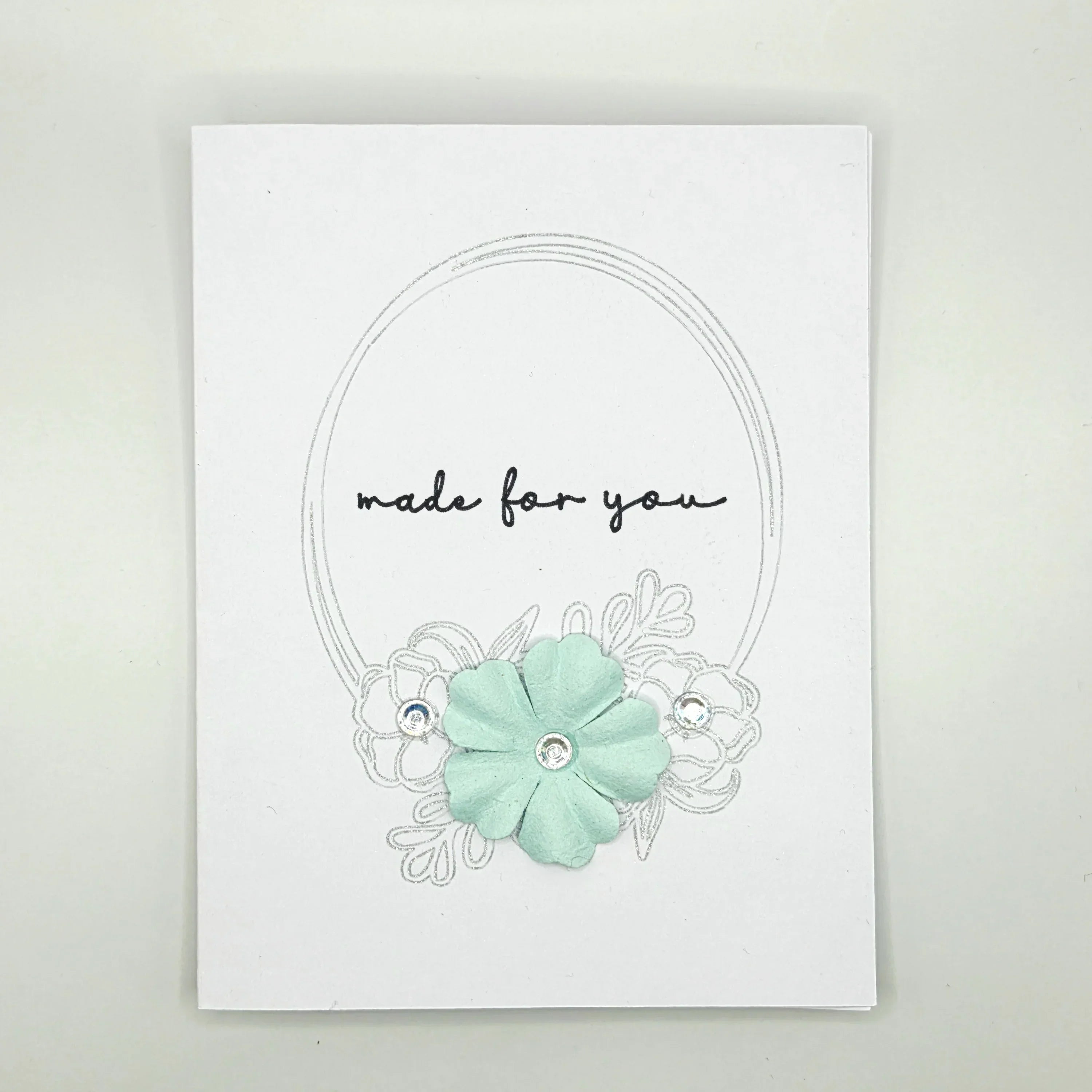 Handmade card with mint flower, 'made for you' text, and silver embellishments