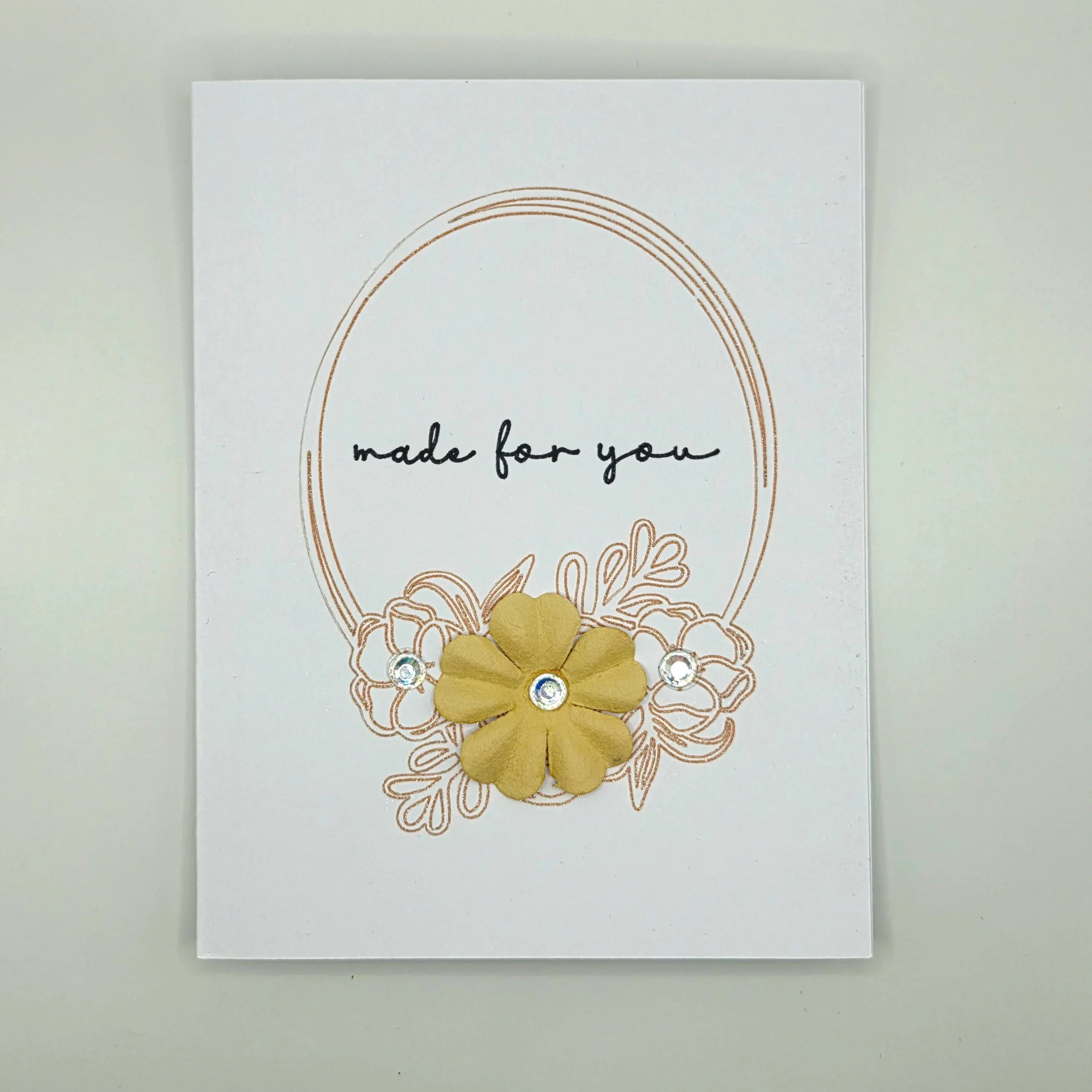 Handmade card with gold flower, 'made for you' text, and rhinestone accents for cozy gifting
