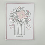 Handmade floral card with glittery vase, pink flowers, butterflies, and rhinestone accents for cozy gifts