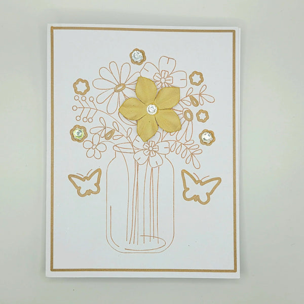 Handmade floral card with gold glitter flowers, butterflies, and rhinestones in a mason jar design