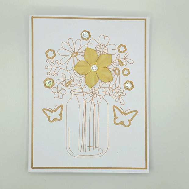 Handmade floral greeting card with yellow flower, butterfly accents, and crystal embellishments