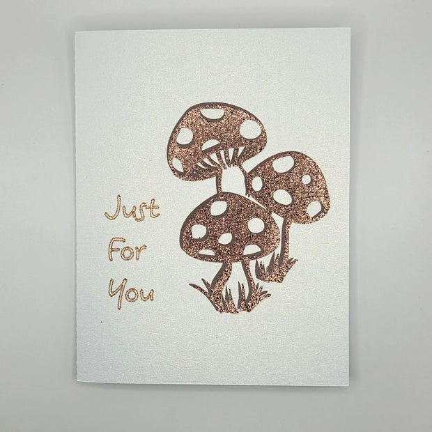 Handmade card with glittery mushrooms and 'Just For You' text on white background