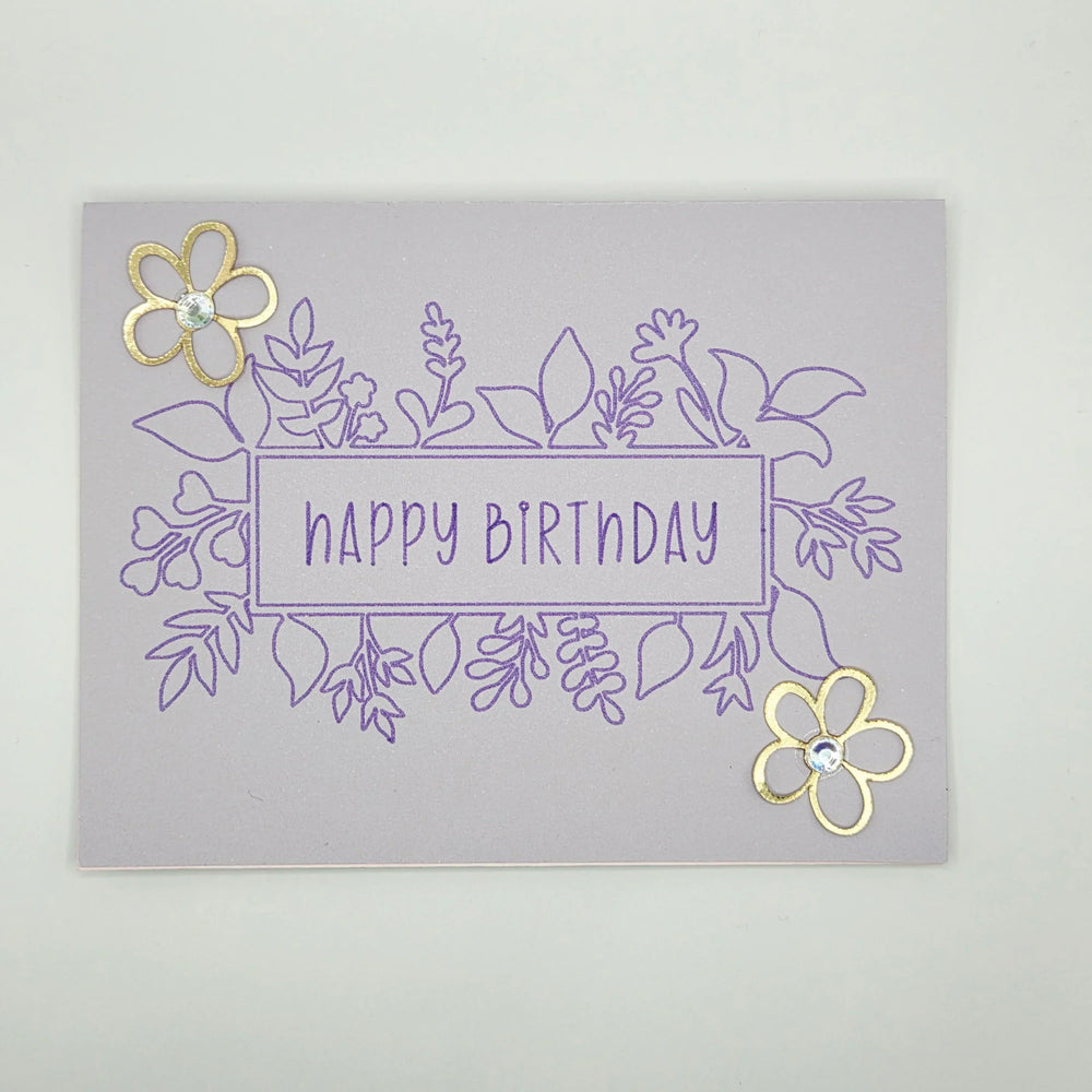 Handmade happy birthday card with purple floral design and gold flower embellishments