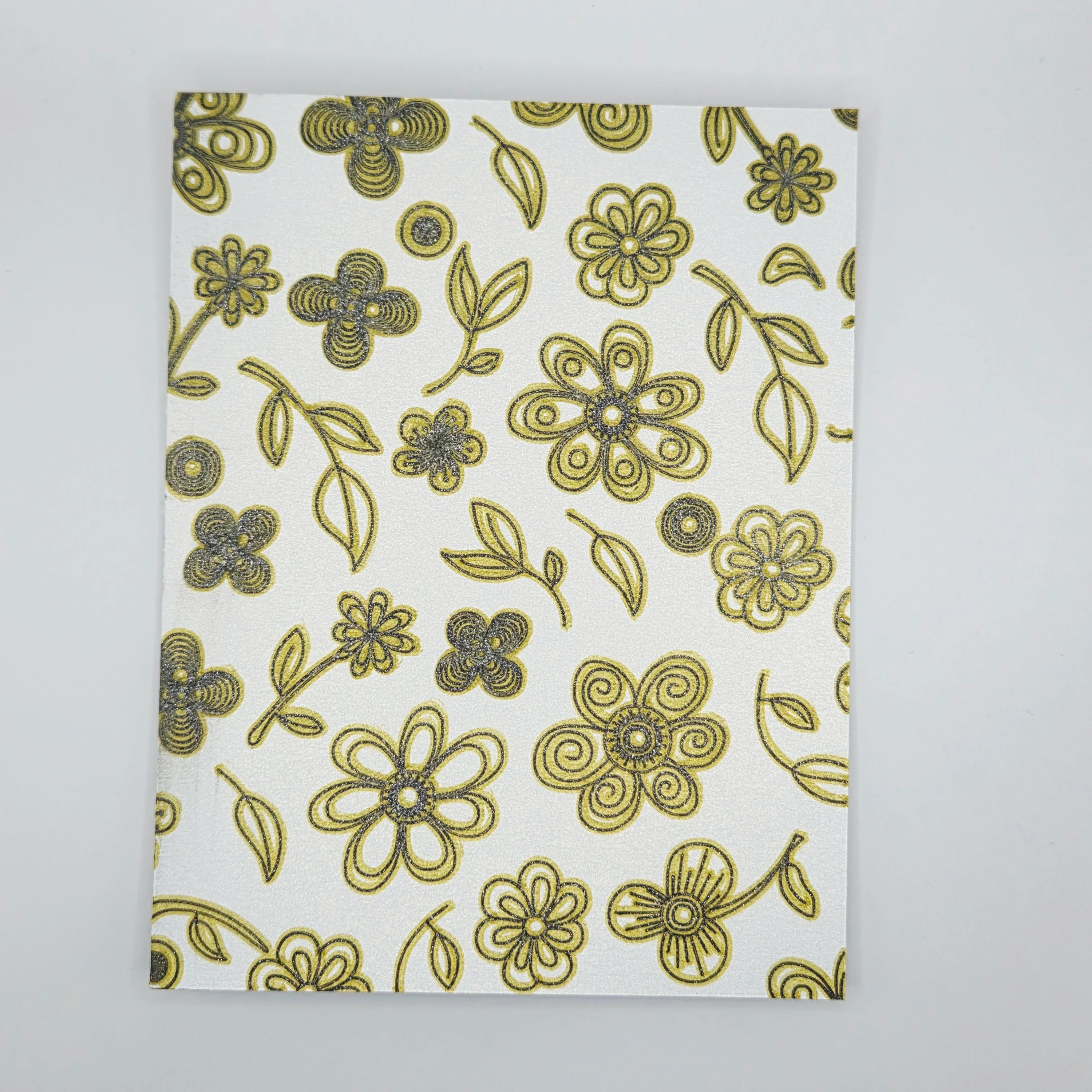 Gold and black hand-drawn floral pattern on handmade white card, Erika Liesel crochet gifts