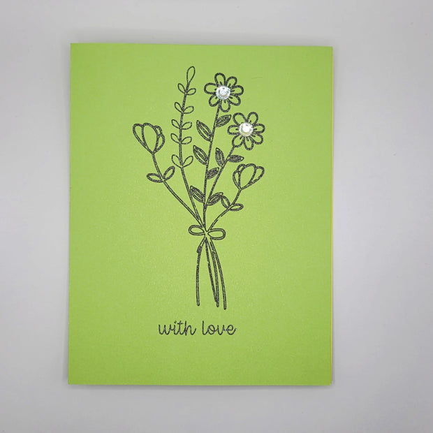Handmade green greeting card with a black floral bouquet and 'with love' message, embellished with gems.