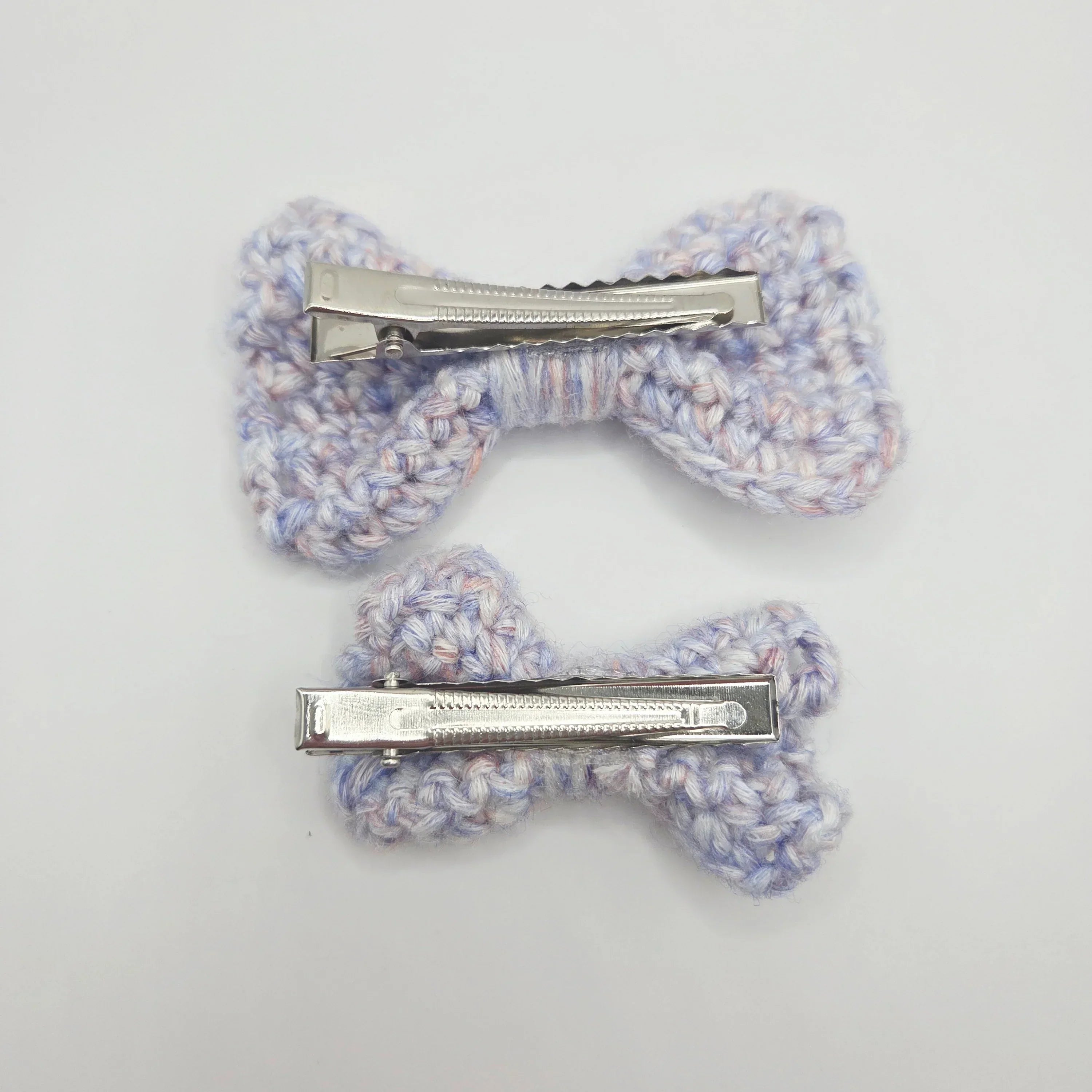 Handmade crochet hair clips in pastel hues, perfect for cozy, creative styling