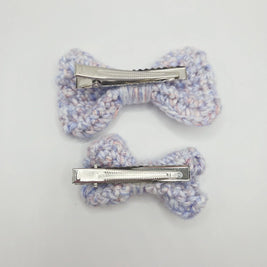 Handmade crochet hair clips in pastel hues, perfect for cozy, creative styling