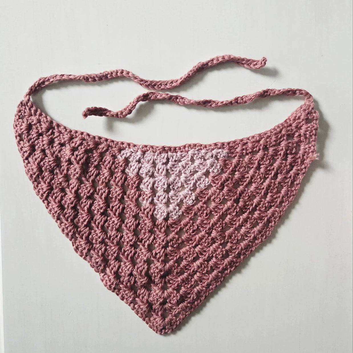 Handmade crochet triangle scarf with pink gradient and lace pattern