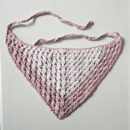Handmade crochet triangle scarf in pink and white, perfect for cozy, creative gifting.
