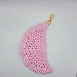 Pink crochet angel wing keychain with gold clasp, handmade cozy accessory