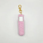 Handmade pink crochet lip balm holder with gold clip, cozy and portable for everyday use