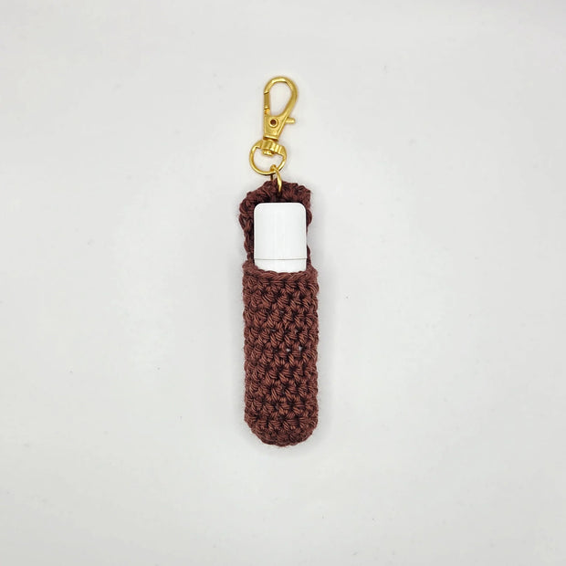 Handmade brown crochet lip balm holder keychain with gold clasp by Erika Liesel