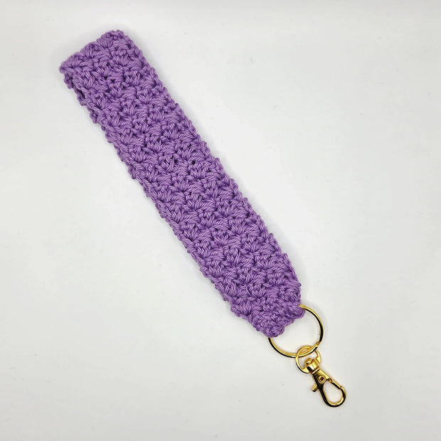 Handmade lavender crochet keychain wristlet with gold clasp on white background