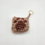 Handmade crochet keychain in earthy tones with gold ring, cozy and creative gift
