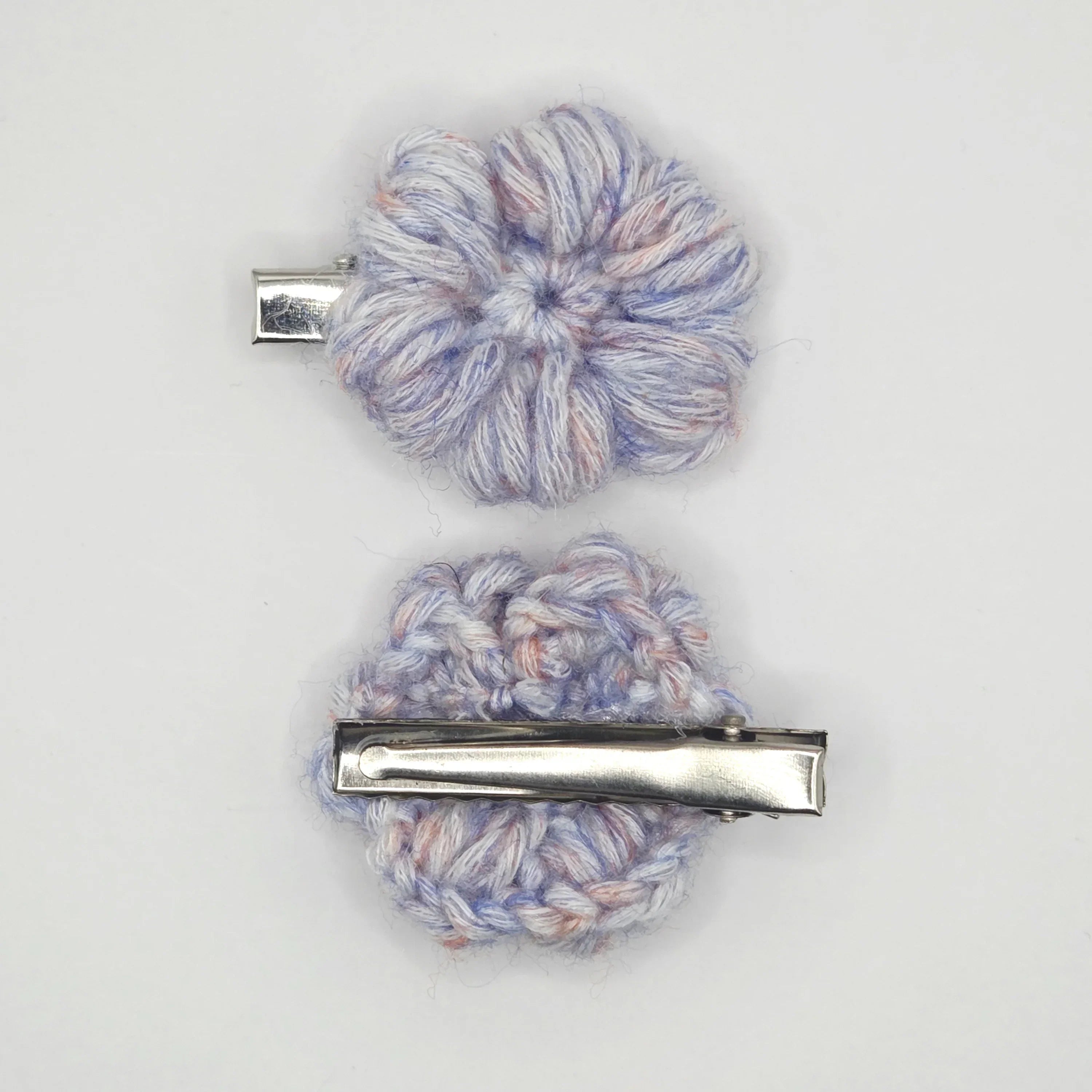Handmade crochet flower hair clips in pastel yarn by Handmade by Erika Liesel