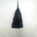 Handmade black crochet triangle wall hanging with openwork pattern, cozy home decor