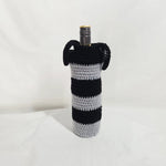 Handmade black and silver striped crochet wine bottle cozy with handles, perfect for gifting