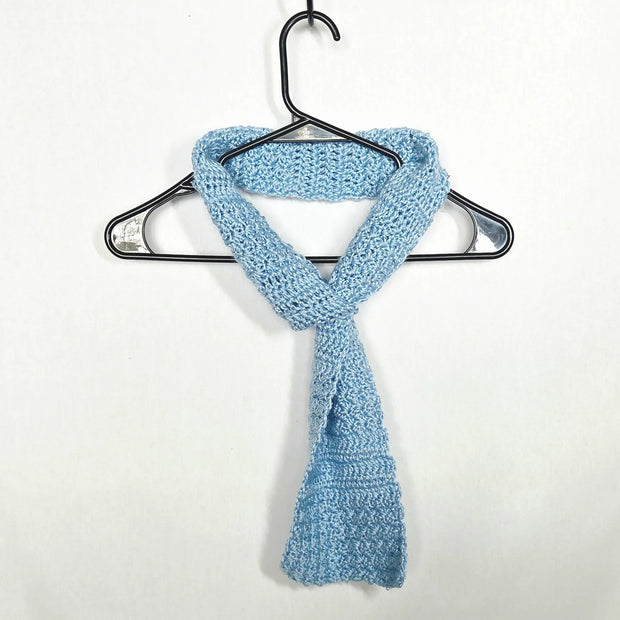 Handmade light blue crochet scarf on hanger, cozy gift by Erika Liesel
