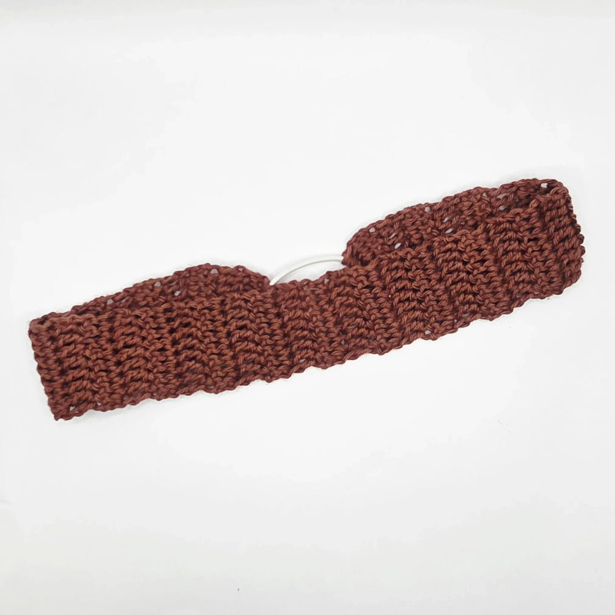 Handmade brown crochet headband on white background, cozy gift by Erika Liesel