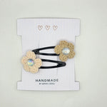 Handmade crochet flower hair clips with iridescent centers, cozy boho accessory