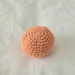 Handmade crochet ball in soft peach, cozy amigurumi gift for comfort and creativity