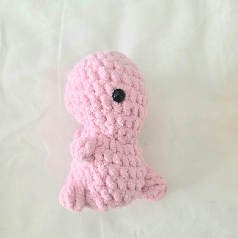 Handmade pink crochet octopus with black button eye, cozy amigurumi toy for comfort and creativity