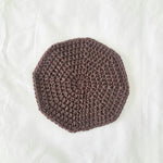 Handmade crochet coaster in dusty rose, cozy and textured for home decor or gifts