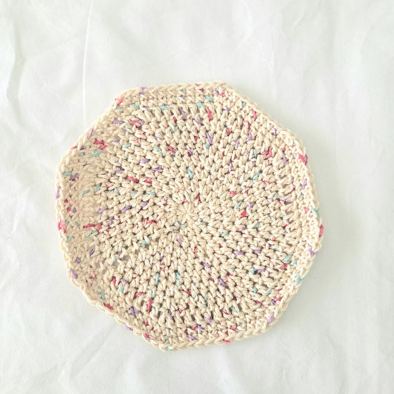 Handmade crochet coaster with pastel speckles, cozy and creative home decor