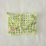 Handmade crochet clutch in green and white with wooden beads, cozy and creative accessory