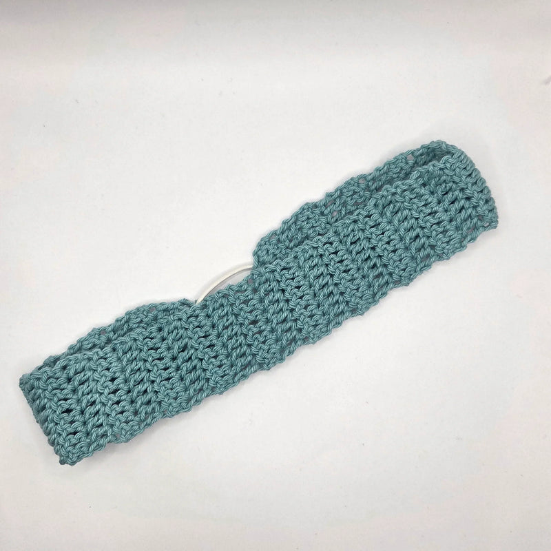 Handmade teal crochet headband with open stitch pattern, cozy and stylish accessory for everyday wear