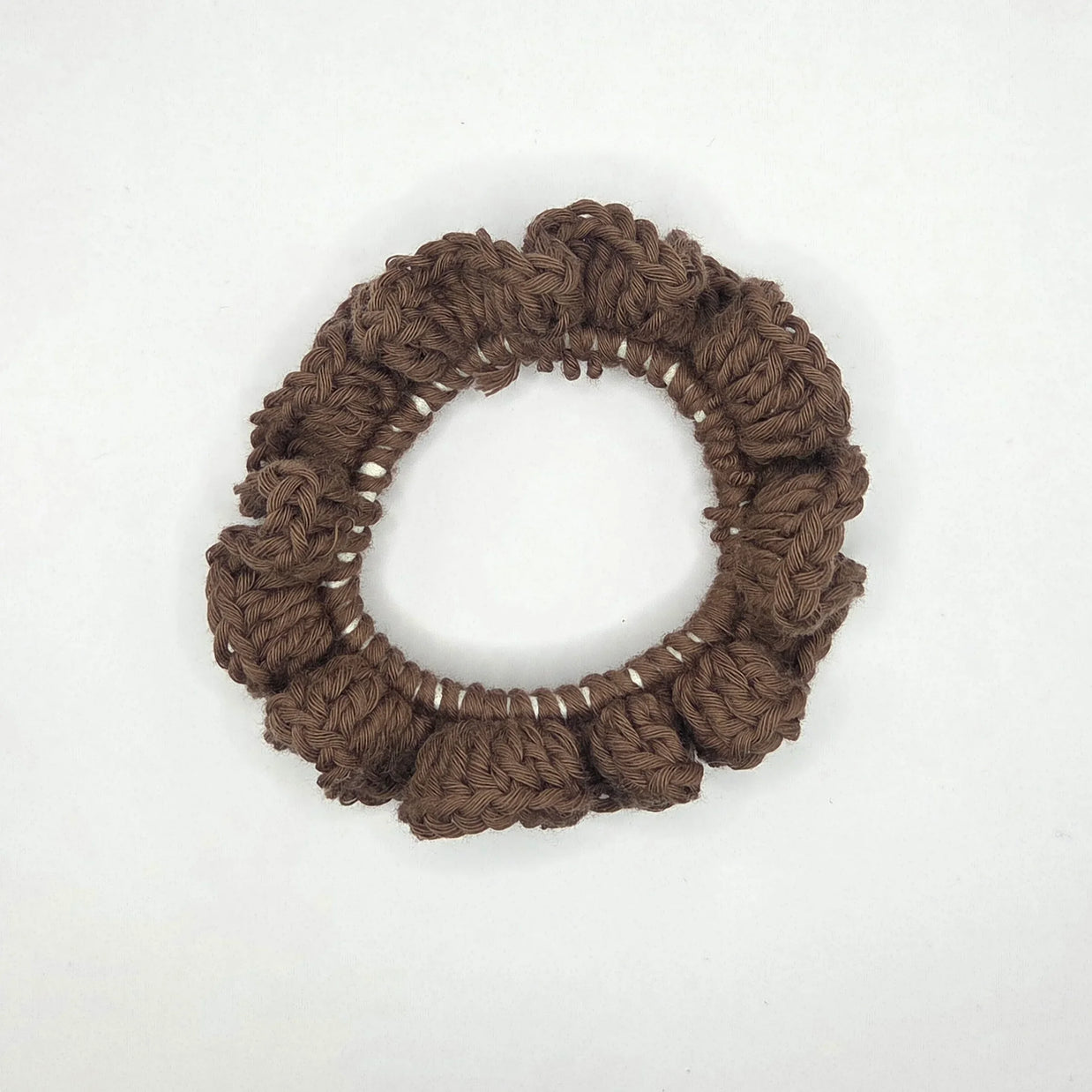 Handmade crochet brown hair scrunchie on white background, cozy gift by Erika Liesel