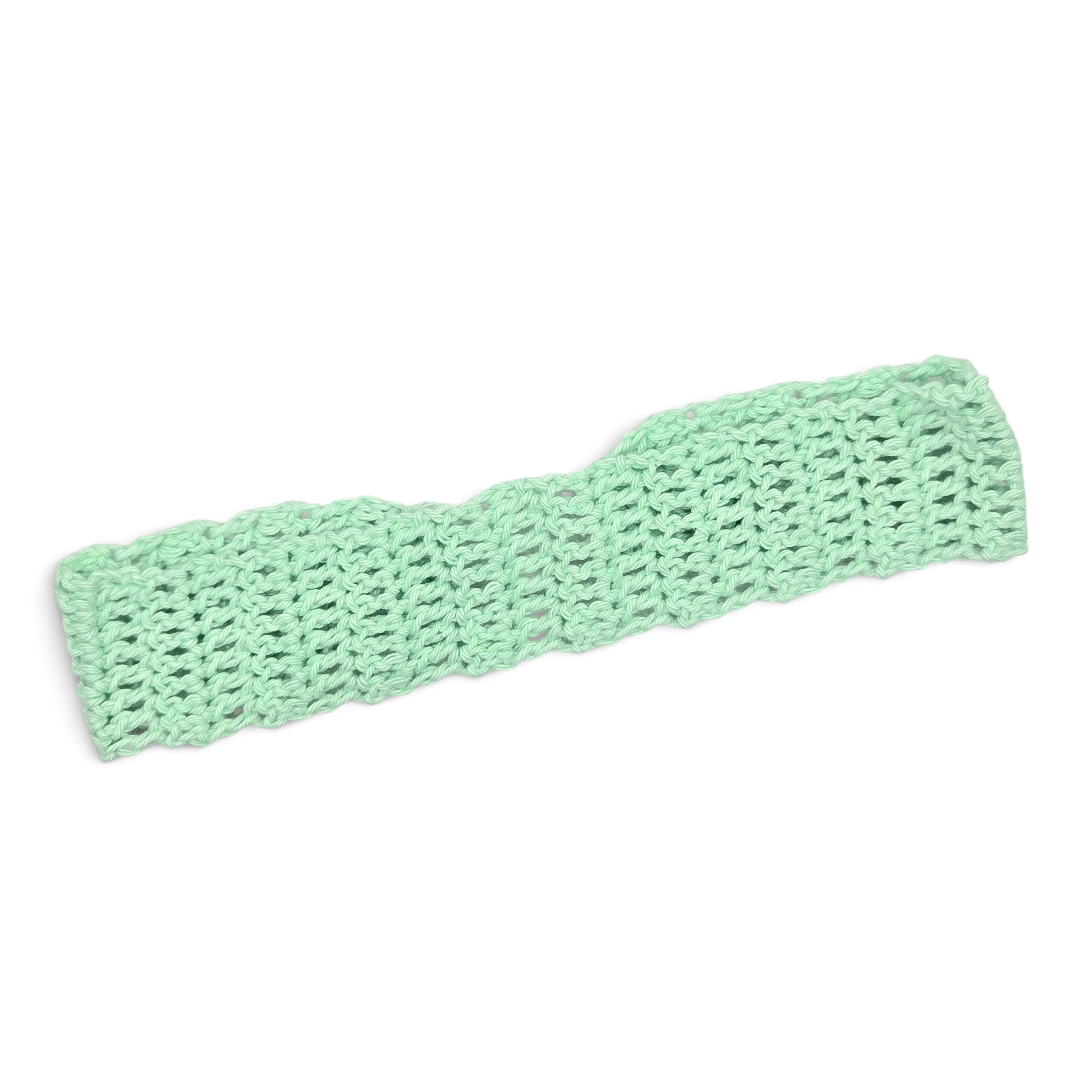 Mint green crochet headband, handmade with cozy open stitch pattern for comfort and style