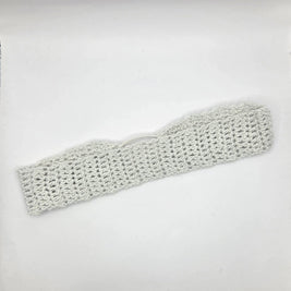 Knitted headband on a light gray background