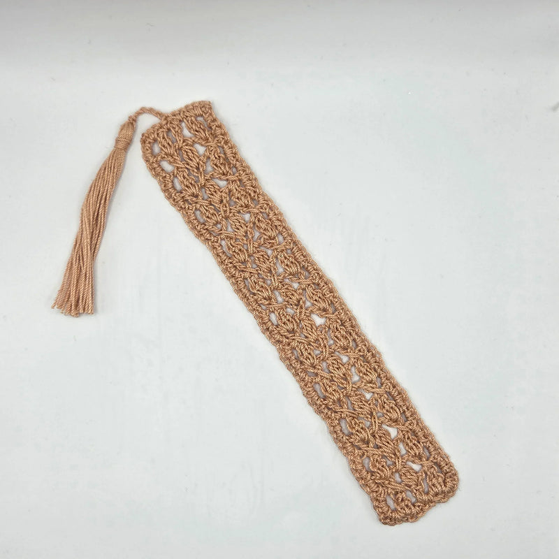 Handmade crochet bookmark with tassel, cozy reading accessory in warm tone