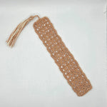 Handmade crochet bookmark with lace pattern and tassel, cozy reading accessory