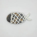 Handmade crochet fish netting over smooth river stone, cozy home decor gift