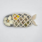 Handmade crochet-wrapped stone with pressed flowers, cozy nature-inspired decor