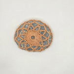 Handmade crochet stone coaster with geometric pattern, cozy home decor gift