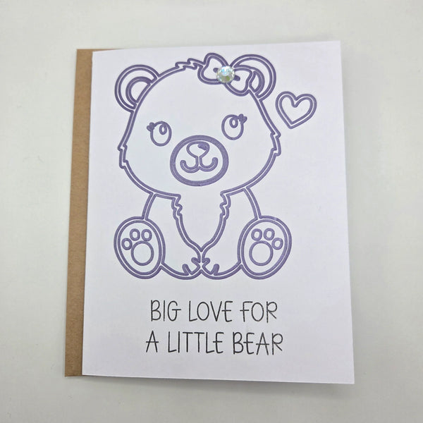 Handmade bear card with purple outline, bow, heart, and gem, saying 'Big Love for a Little Bear'