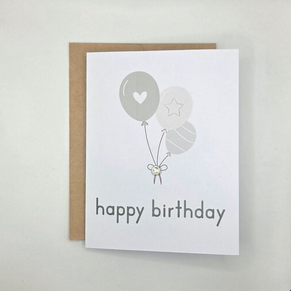 Happy birthday card with gray balloons, heart, star, and gem accent